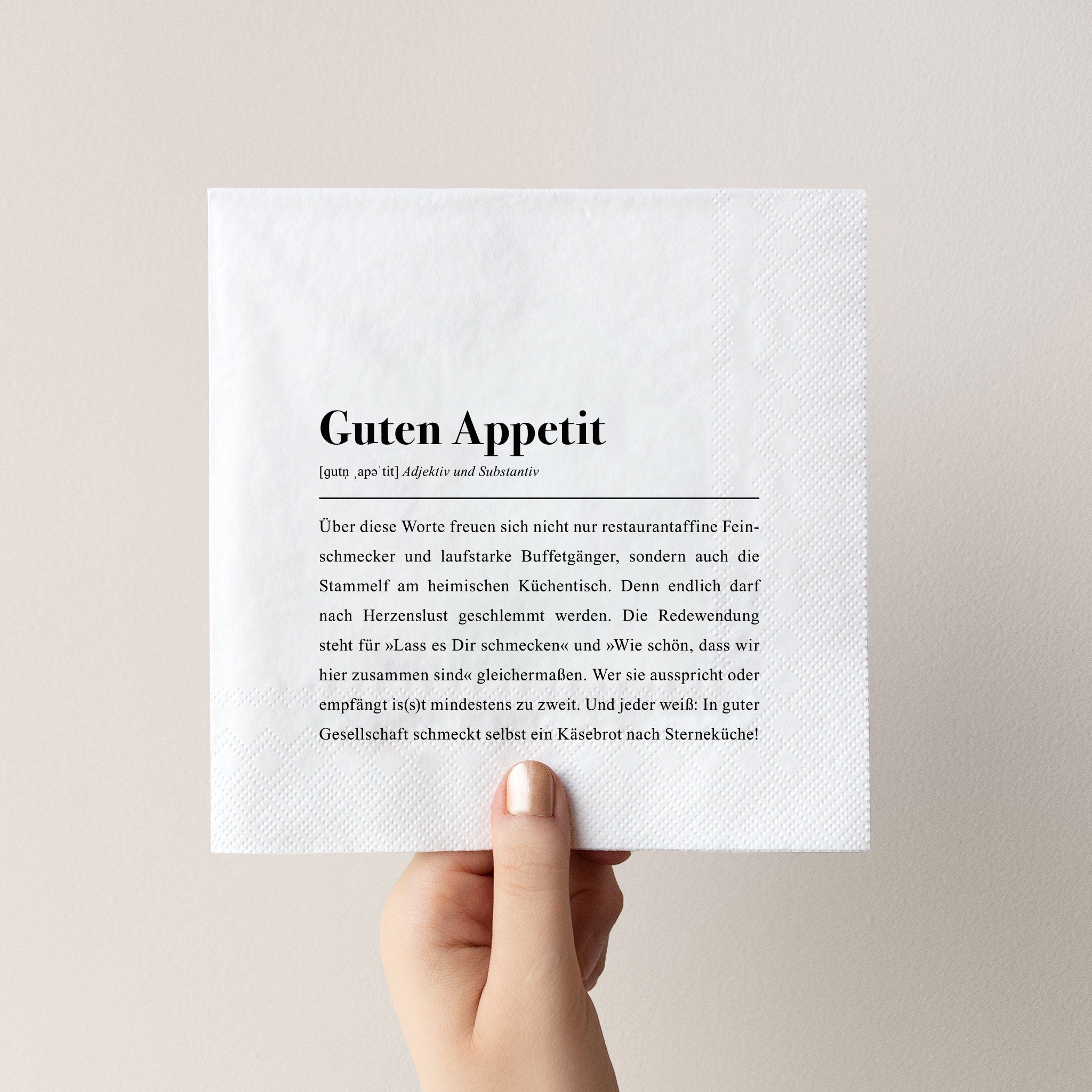 Schwarz-weiße Papierserviette mit lustigem Spruch: Guten Appetit!